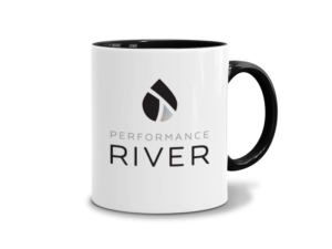 A mug displays the Performance River logo, designed by FatRabbit Creative