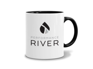 A mug displays the Performance River logo, designed by FatRabbit Creative