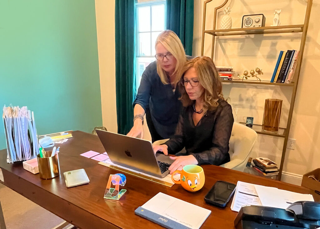 CEO Heather and Digital Director Kimberly working on client management