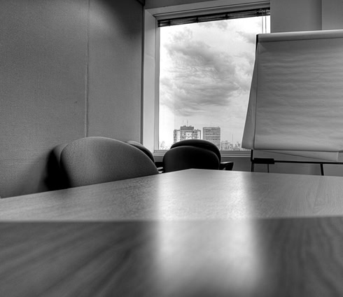 Black and white photo of an empty conference room