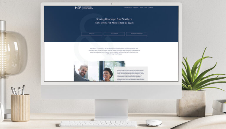 Heymann & Fletcher homepage shown on a desktop computer