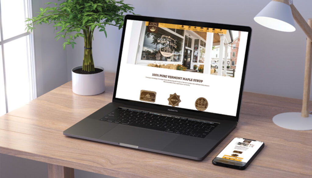 The Maple Shop website shown on a laptop